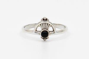 Picture of the Kaia ring, a Nelumbo jewelry piece, handmade from 925 sterling silver and onyx stone