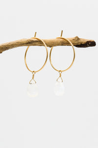 Picture of the Laality earrings, a Nelumbo jewelry piece, handmade from 14K gold and moonstone