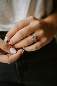 Picture of the Rashii ring, a Nelumbo jewelry piece, handmade from 925 sterling silver and prehnite stone