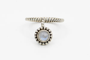 Picture of the Satya ring, a Nelumbo jewelry piece, handmade from 925 sterling silver and moonstone