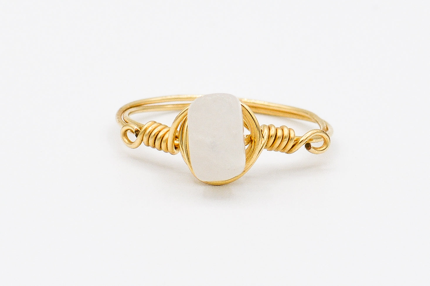 Picture of the Shiva ring, a Nelumbo jewelry piece, handmade from 14k solid gold and milky quartz