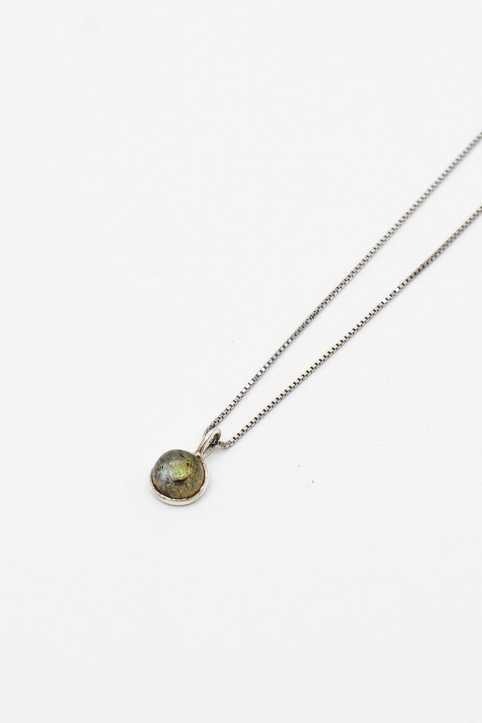 Picture of the Sarika necklace, a Nelumbo jewelry piece, handmade from 925 sterling silver and labradorite stone