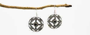 Picture of the Edena earrings, a Nelumbo jewelry piece, handmade from 925 sterling silver and onyx stone