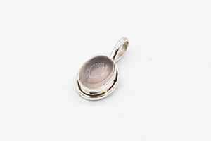 Picture of the Sahar necklace, a Nelumbo jewelry piece, handmade from 925 sterling silver and pink quartz