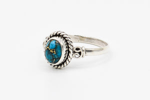 Picture of the Delia ring, a Nelumbo jewelry piece, handmade from 925 sterling silver and turquoise stone