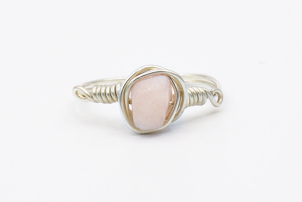 Picture of the Tiya ring, a Nelumbo jewelry piece, handmade from 925 sterling silver and pink quartz