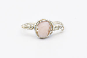 Picture of the Tiya ring, a Nelumbo jewelry piece, handmade from 925 sterling silver and pink quartz